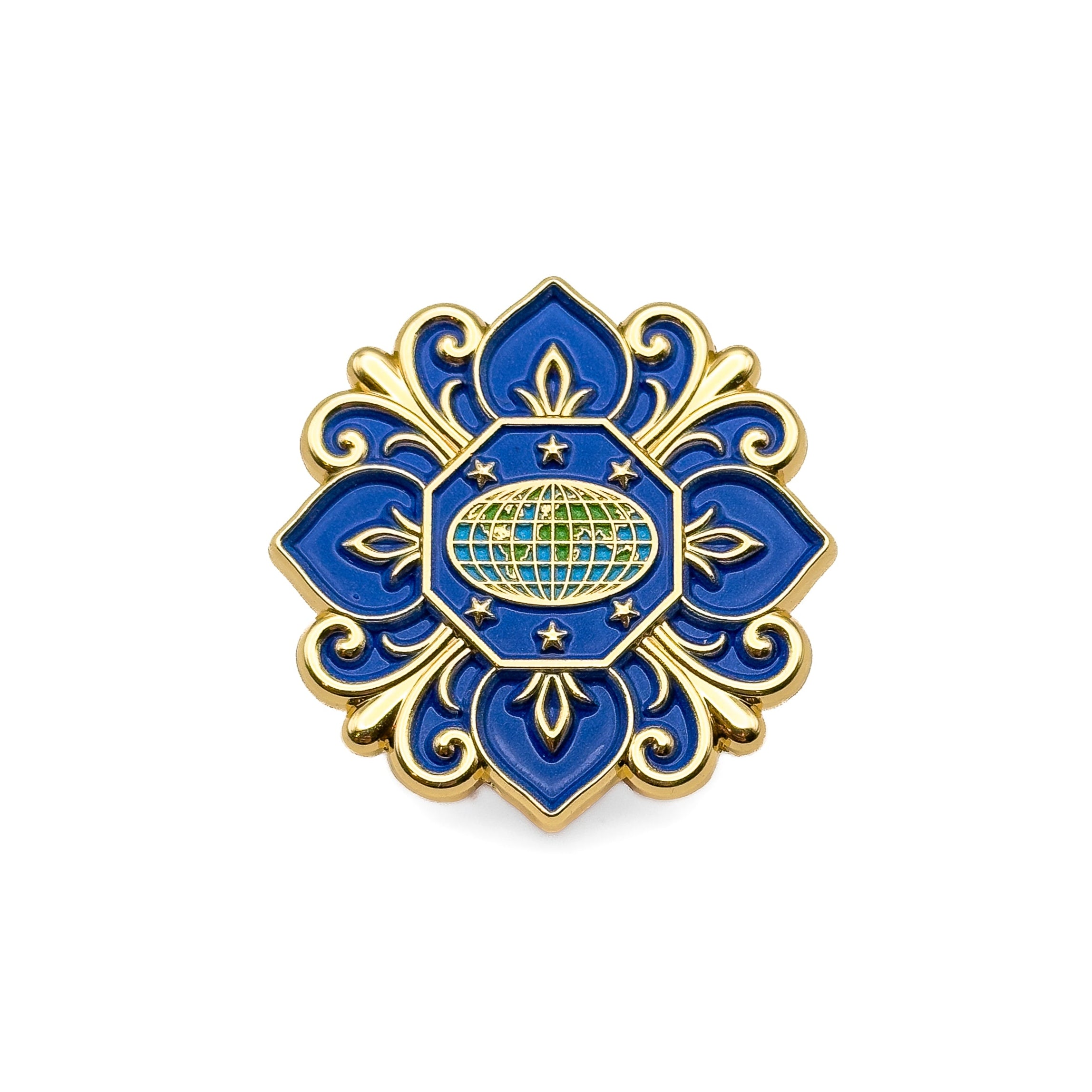 Decorative blue and gold pin with a central globe design on a white background