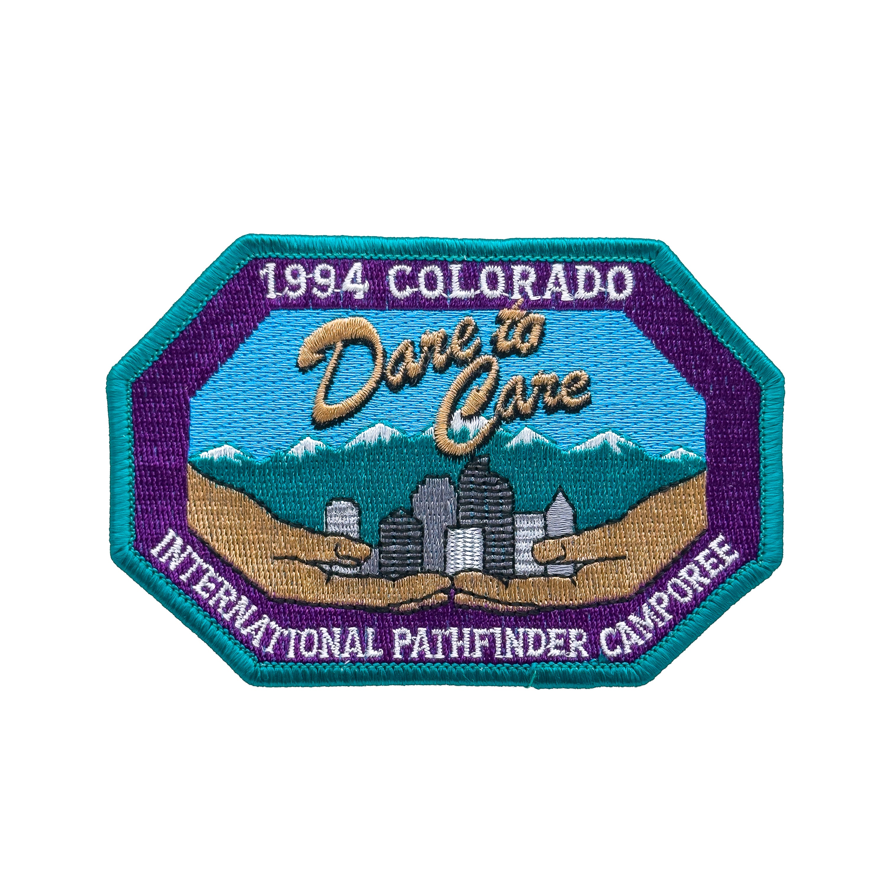 Embroidered patch with '1994 Colorado Dare to Care International Pathfinder Camporee' text and landscape design.